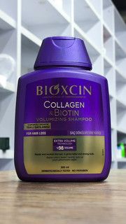 شامپو مو بیوتین و کلاژن بیوکسین BIOXCIN مناسب موهای نازک و کم حجم و ضعیف حجم 300 میلی لیتر